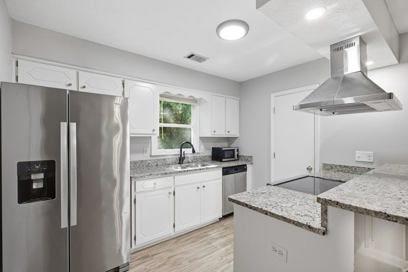 Quaint country living with this remodeled 4BR 2BA home sitting - photo 8