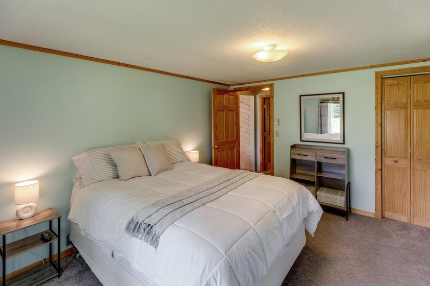 Towering mature pine trees on 5 private acres, this beautiful - photo 22