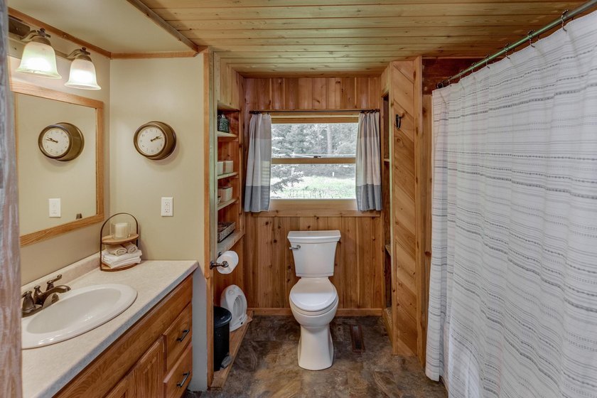 Towering mature pine trees on 5 private acres, this beautiful - photo 24