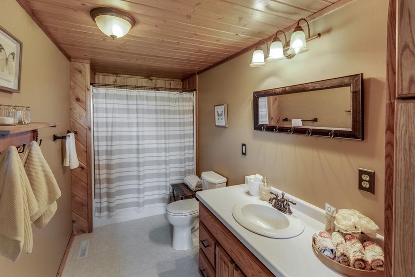 Towering mature pine trees on 5 private acres, this beautiful - photo 25