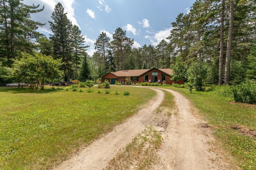 Towering mature pine trees on 5 private acres, this beautiful - photo 35