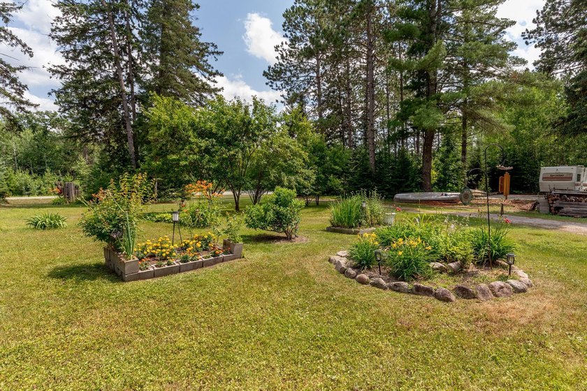 Towering mature pine trees on 5 private acres, this beautiful - photo 36