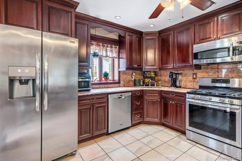 Set on a level, fully fenced property in East Islip, this 3 - photo 11