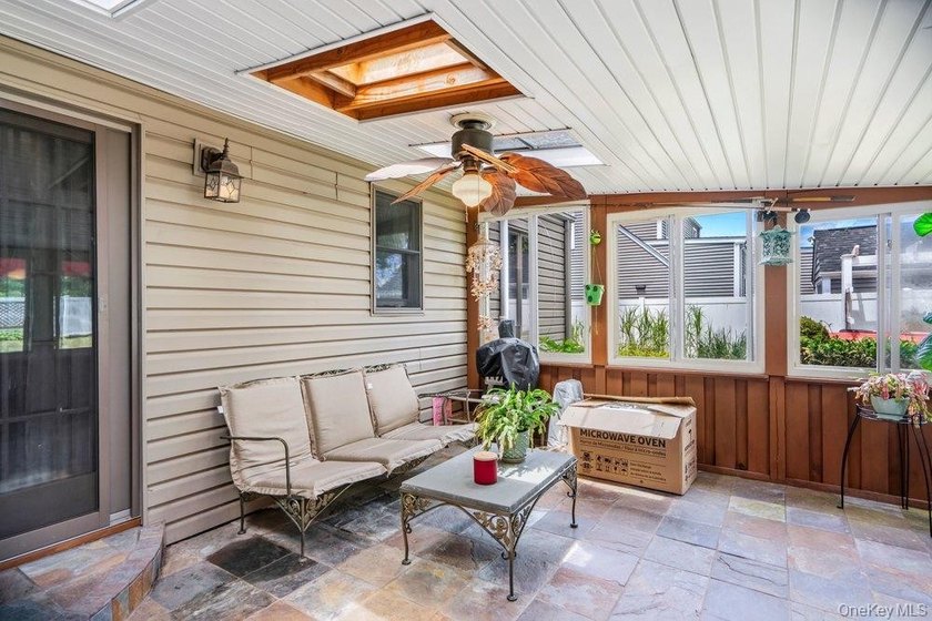 Set on a level, fully fenced property in East Islip, this 3 - photo 24