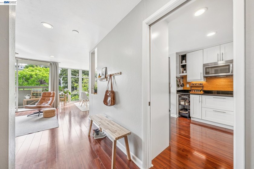 Perched on the top floor, this bright and stylishly upgraded - photo 8