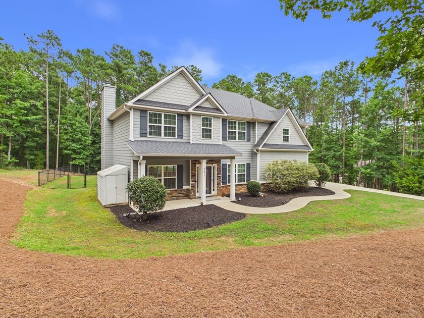 Set on over two private, wooded acres, this beautifully updated - photo 2