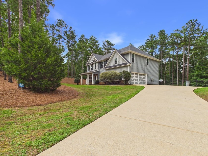 Set on over two private, wooded acres, this beautifully updated - photo 4