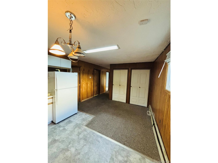 High Ranch With Updated Kitchen And Large Living Room. Hardwood - photo 15