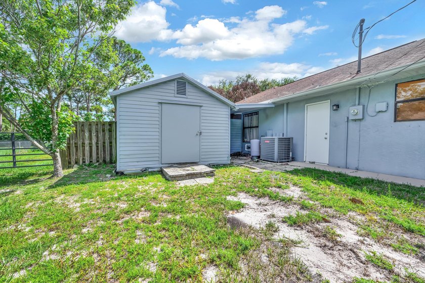 Welcome to this charming 3/2/2 home located on an oversized - photo 3