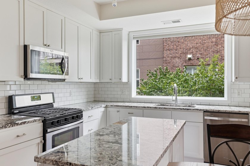 Experience sophisticated, low-maintenance living at **Wooddale - photo 23