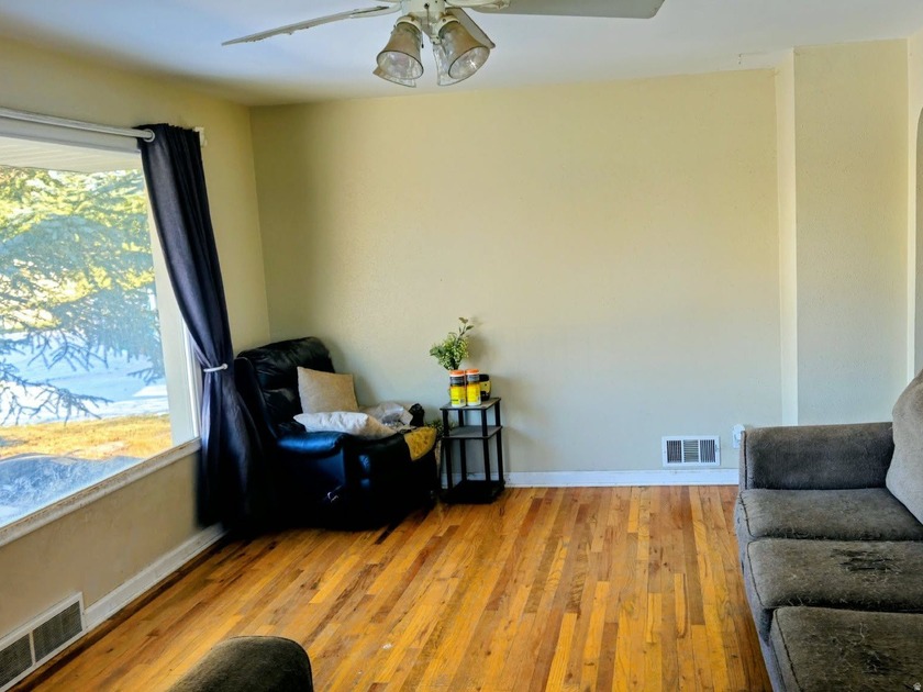 Take a look at this inviting 4-bedroom, 2-bathroom home tucked - photo 4