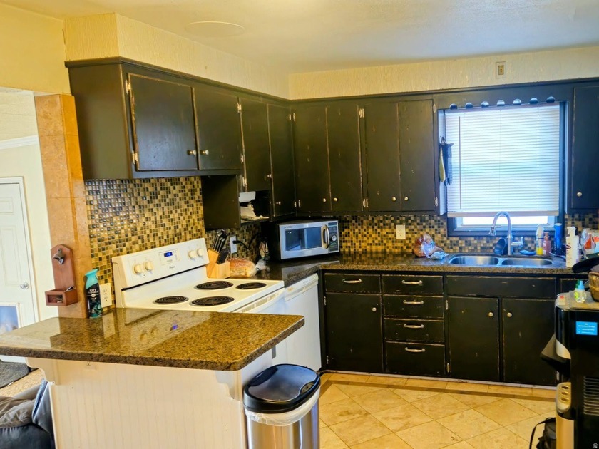 Take a look at this inviting 4-bedroom, 2-bathroom home tucked - photo 6