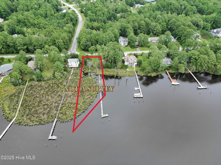 Waterfront homesite with extensive dock frontage in the gated - photo 3