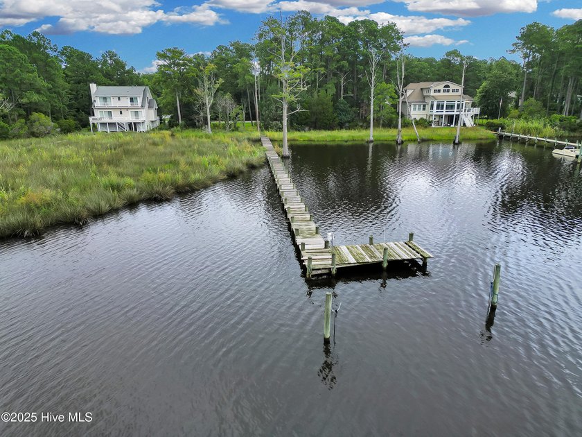 Waterfront homesite with extensive dock frontage in the gated - photo 4