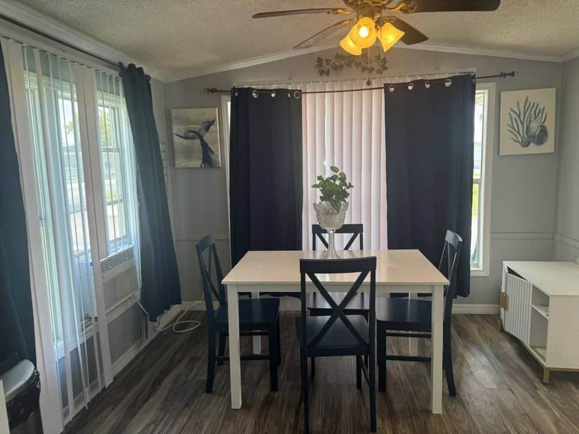 PARADISE AT YOUR FINGERTIPS! This AFFORDABLE home is in the LOW - photo 9