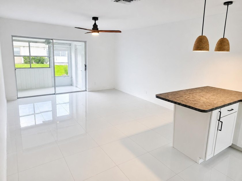 Welcome home to this beautifully upgraded villa in a peaceful - photo 3
