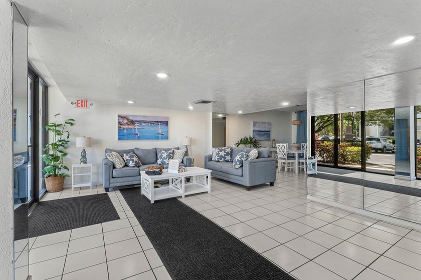 Positioned mere steps from the shoreline, this three-bedroom - photo 29