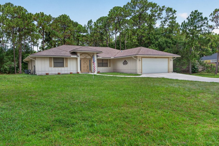 Enjoy peaceful country living in Jupiter Farms with this - photo 2