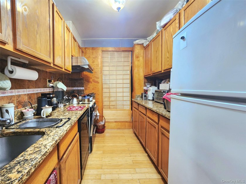 Welcome to unit 1K at 143-07 Sanford Avenue, a well-maintained - photo 13