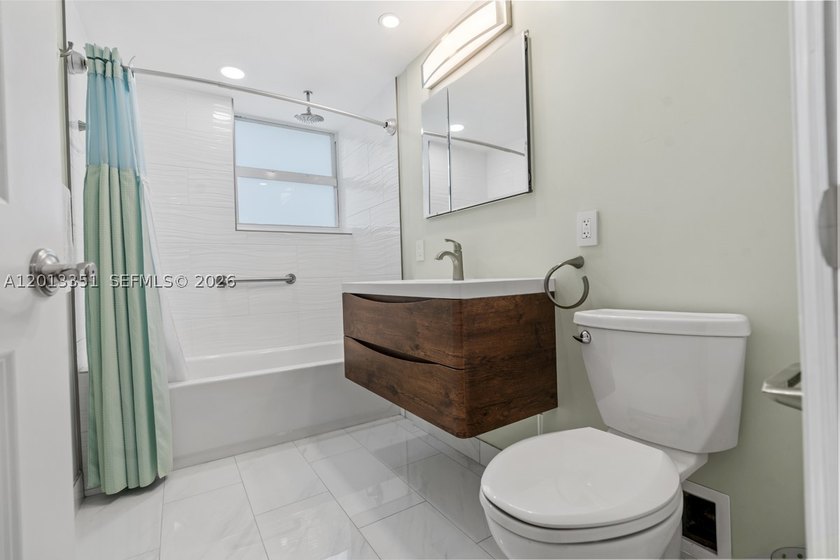 Fully renovated and thoughtfully reimagined, this east-facing - photo 17