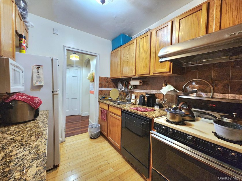 Welcome to unit 1K at 143-07 Sanford Avenue, a well-maintained - photo 17
