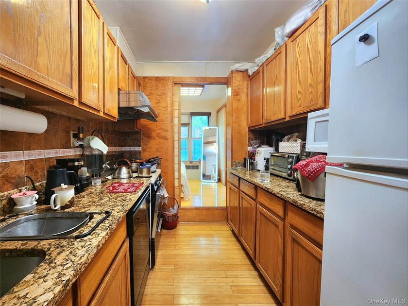 Welcome to unit 1K at 143-07 Sanford Avenue, a well-maintained - photo 18