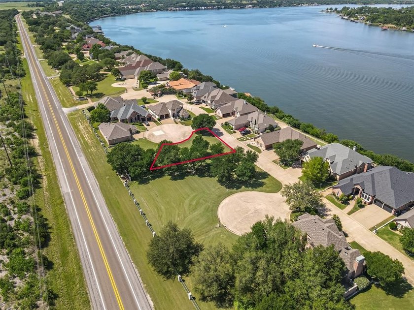 Nestled on a quiet street within the prestigious gated Bluff - photo 14