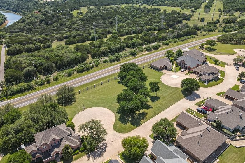 Nestled on a quiet street within the prestigious gated Bluff - photo 16