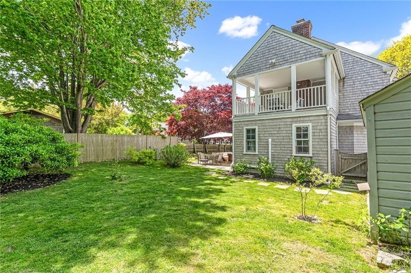 A gracious residence tucked along a picturesque street just off - photo 18