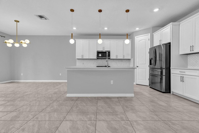 Welcome to this two-story residence located in Fields in Lake - photo 4