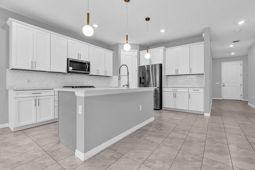 Welcome to this two-story residence located in Fields in Lake - photo 5