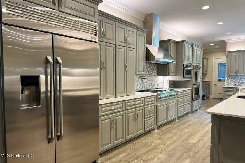 Discover this exceptional residence in The Highlands, a premier - photo 12