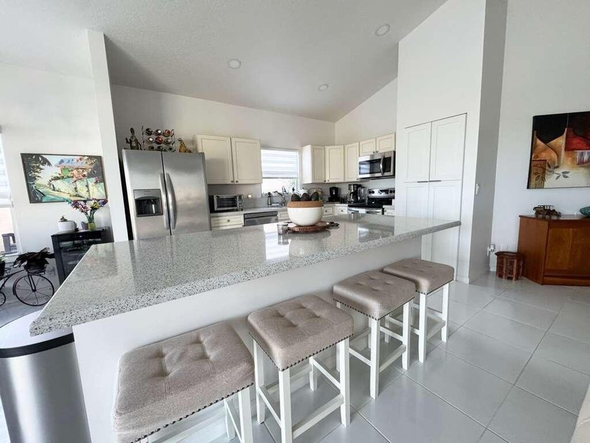 Beautifully updated lakefront home featuring a 2023 roof, impact - photo 2