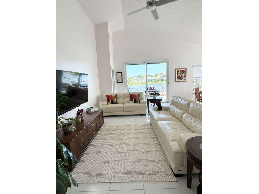Beautifully updated lakefront home featuring a 2023 roof, impact - photo 3