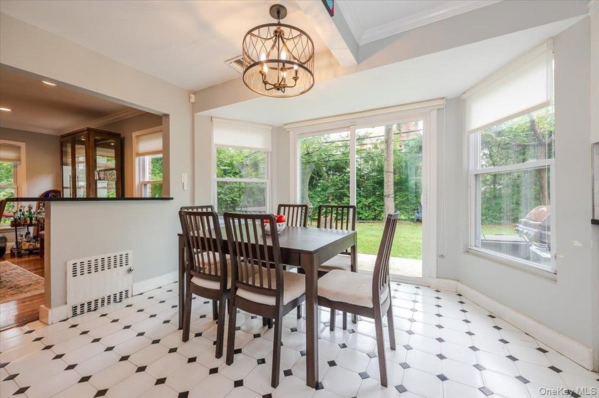 Welcome to this sunlit all brick center hall colonial located in - photo 13