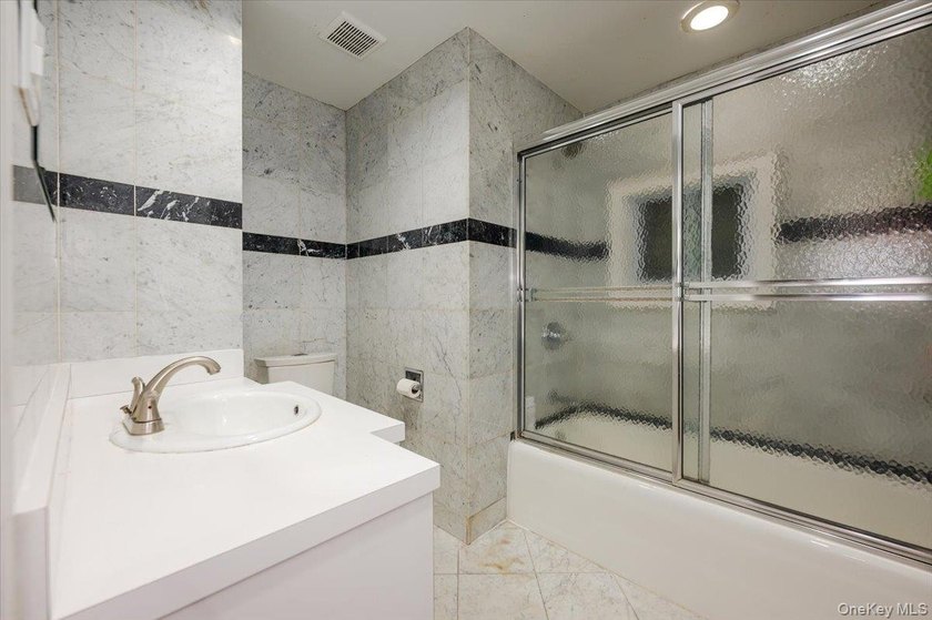 Welcome to this sunlit all brick center hall colonial located in - photo 16