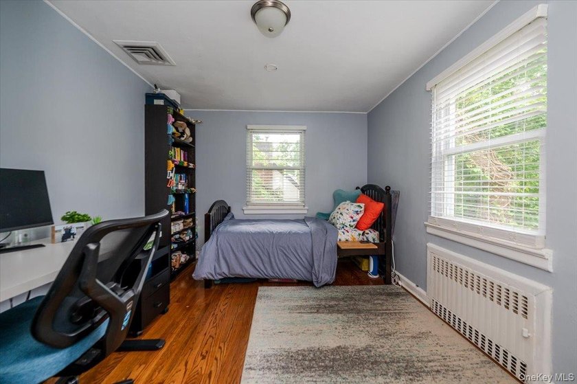 Welcome to this sunlit all brick center hall colonial located in - photo 18