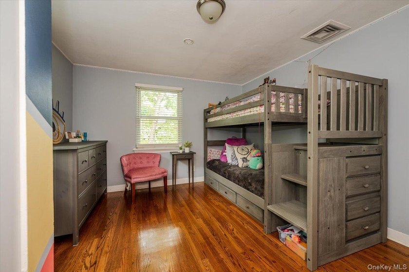 Welcome to this sunlit all brick center hall colonial located in - photo 19