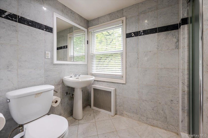 Welcome to this sunlit all brick center hall colonial located in - photo 20