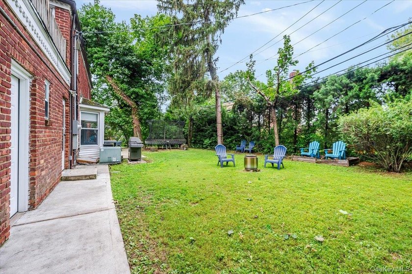 Welcome to this sunlit all brick center hall colonial located in - photo 25