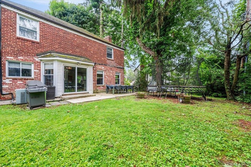 Welcome to this sunlit all brick center hall colonial located in - photo 26