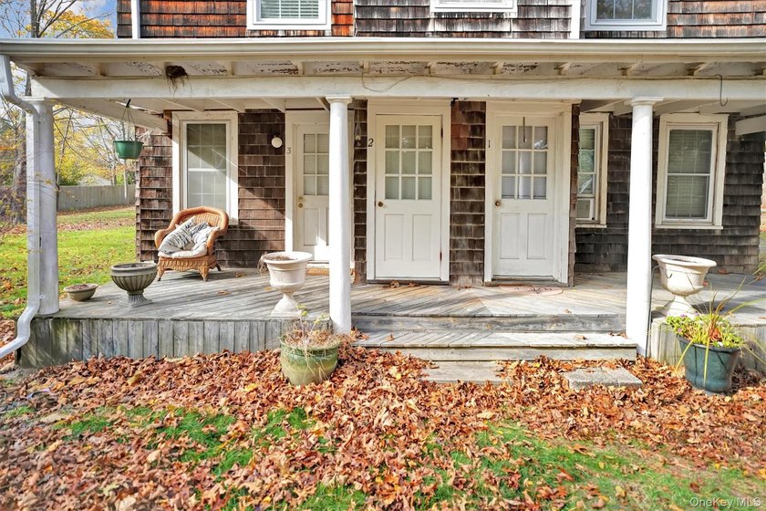 Multi-Family: Located down a tree lined street in the hamlet of - photo 2