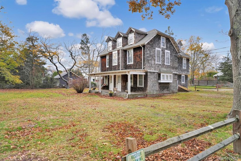 Multi-Family: Located down a tree lined street in the hamlet of - photo 3