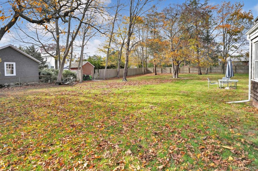 Multi-Family: Located down a tree lined street in the hamlet of - photo 7