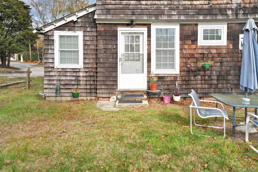 Multi-Family: Located down a tree lined street in the hamlet of - photo 8
