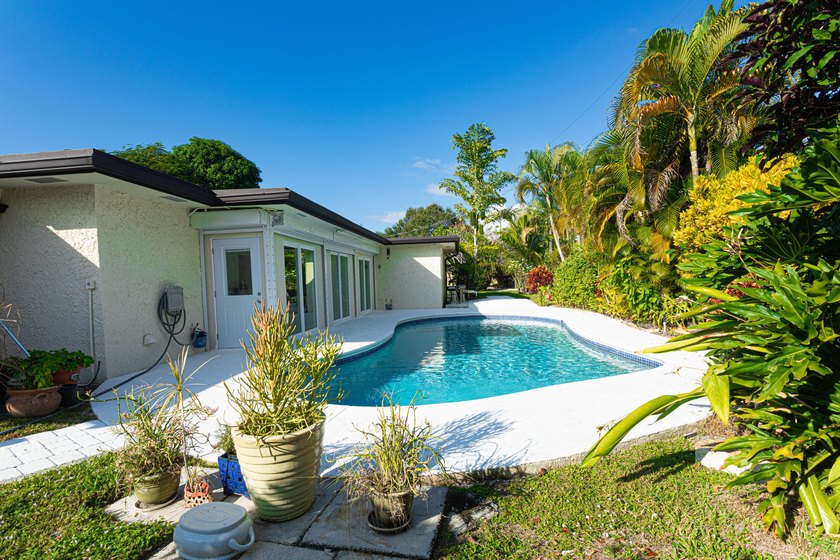 Tucked away on an oversized corner lot in the sought-after - photo 24
