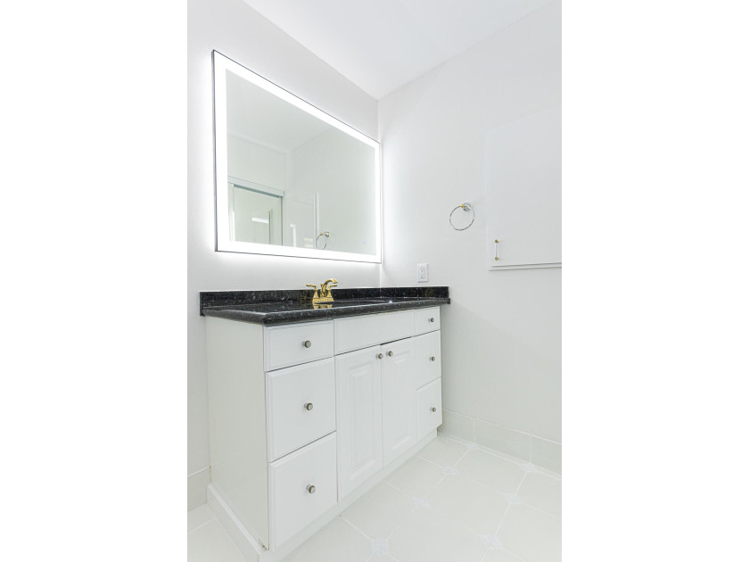 Tucked away on an oversized corner lot in the sought-after - photo 38