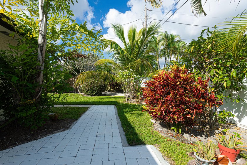Tucked away on an oversized corner lot in the sought-after - photo 43