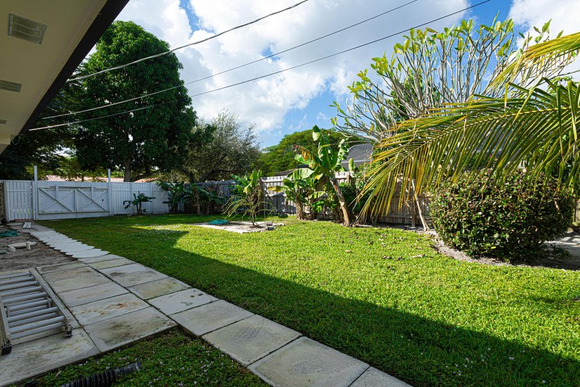 Tucked away on an oversized corner lot in the sought-after - photo 44