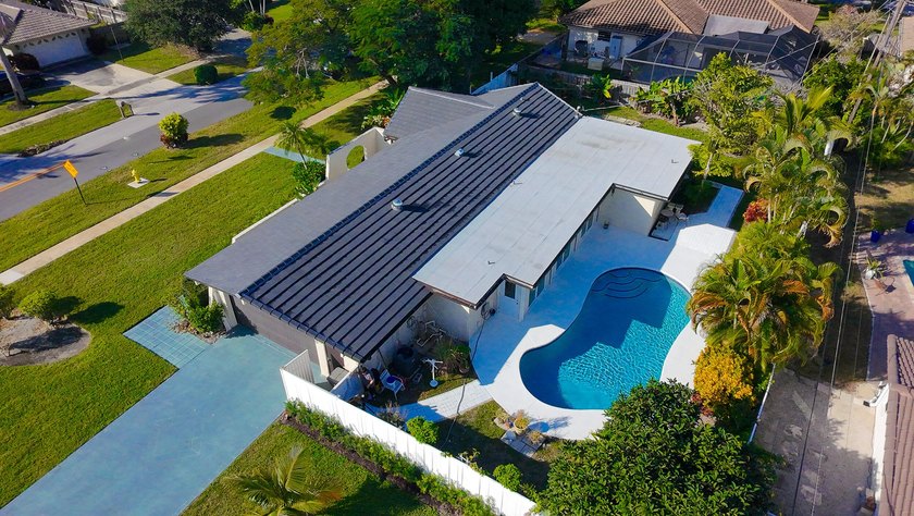Tucked away on an oversized corner lot in the sought-after - photo 46